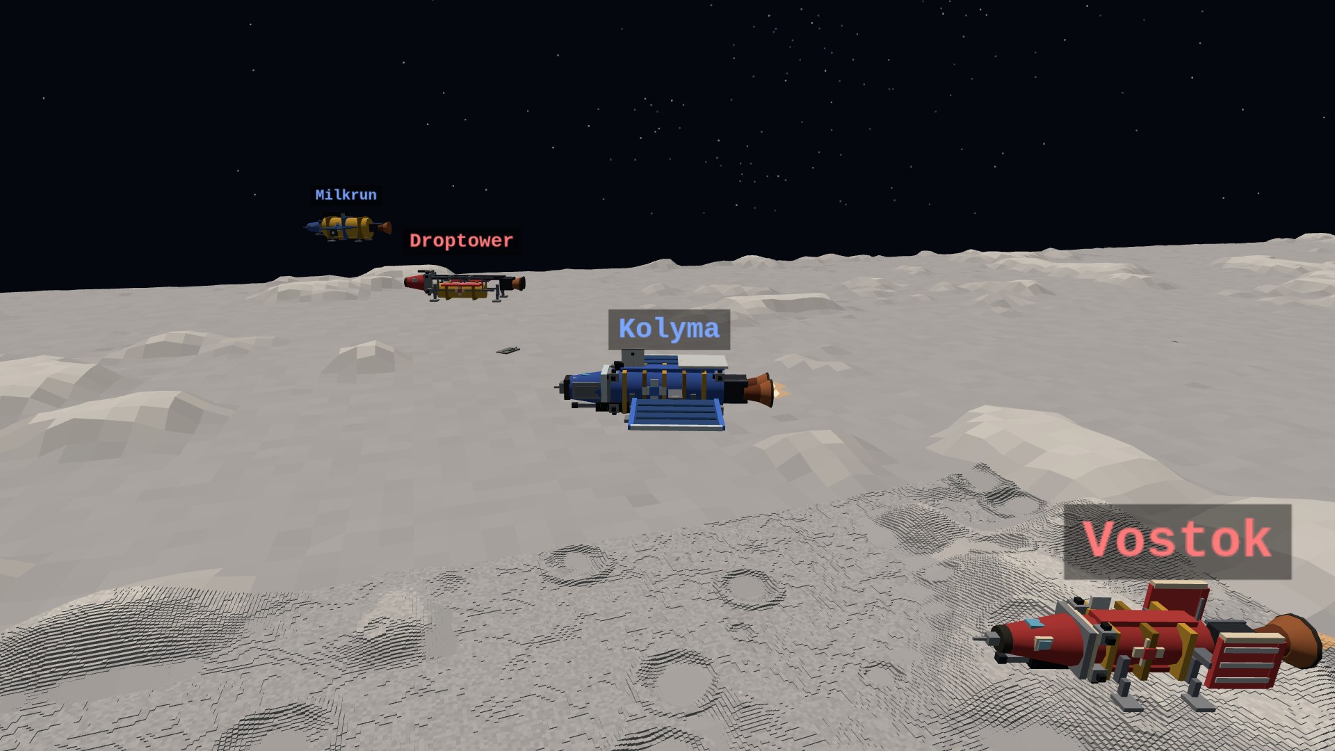 Four blocky spacecraft in echelon over the cratered gray moon: the red Dart interceptor on its landing legs, the blue Bastion corvette burning its bells, the Hammer ordnance barge with an open rack of rods, and the gold drum-hulled Mule tender